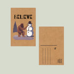 Load image into Gallery viewer, Bigfoot Believe Snowman Christmas Brown Kraft Paper Postcard
